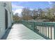 Outdoor deck overlooking neighborhood showcasing wooden railing, and serene atmosphere at 390 Boundary Ave., Murrells Inlet, SC 29576