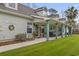 Charming home featuring inviting front porch with string lights and mature landscaping at 390 Boundary Ave., Murrells Inlet, SC 29576