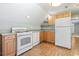 Bright kitchen featuring modern appliances, plenty of cabinet storage, and laminate flooring at 390 Boundary Ave., Murrells Inlet, SC 29576