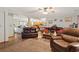 Open-concept living room with hardwood floors that flows seamlessly into kitchen and dining area at 390 Boundary Ave., Murrells Inlet, SC 29576