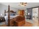 Comfortable main bedroom featuring hardwood floors and ensuite bathroom access at 390 Boundary Ave., Murrells Inlet, SC 29576