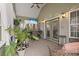 Relaxing covered patio with comfortable seating and view of the outdoors at 390 Boundary Ave., Murrells Inlet, SC 29576