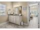 Bathroom with double vanity, great lighting, and view to the Primary Bedroom at 413 Wine Ct., Conway, SC 29527