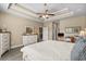 Well-lit bedroom with tray ceiling, neutral colors, and furnishings create a relaxing space at 413 Wine Ct., Conway, SC 29527