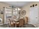 Cozy dining area with wicker chairs, decorative walls, and lots of natural light at 413 Wine Ct., Conway, SC 29527
