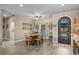 Bright dining room with wood table set for six and stylish wood-look flooring at 413 Wine Ct., Conway, SC 29527