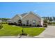 Charming one-story brick home with well-maintained lawn and landscaping at 413 Wine Ct., Conway, SC 29527