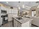 Open concept kitchen with granite counters, stainless steel appliances, and kitchen island at 413 Wine Ct., Conway, SC 29527