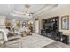 Inviting living room with large tv, ceiling fan, tray ceilings, and neutral decor at 413 Wine Ct., Conway, SC 29527