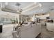 Spacious living room with tray ceilings flows into the kitchen and features lots of natural light at 413 Wine Ct., Conway, SC 29527