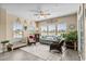 Inviting living room with natural light, comfortable seating, ceiling fan, and stylish decor at 413 Wine Ct., Conway, SC 29527