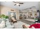 Spacious living room with open floor plan, ceiling fan, and access to outdoor patio at 413 Wine Ct., Conway, SC 29527