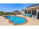 Backyard with a sparkling in-ground pool, patio area, and plenty of seating at 413 Wine Ct., Conway, SC 29527