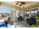 Cozy sunroom with brick accents, ample windows, comfortable seating, and access to outdoor patio at 413 Wine Ct., Conway, SC 29527