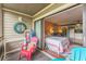Balcony with outdoor furniture and open doorway to bedroom/living room at 415 Ocean Creek Dr. # 2330, Myrtle Beach, SC 29572