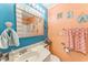 Bathroom with a large mirror, beach themed decor, and good lighting at 415 Ocean Creek Dr. # 2330, Myrtle Beach, SC 29572