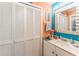 Bathroom with storage space, large mirror, and beach themed decor at 415 Ocean Creek Dr. # 2330, Myrtle Beach, SC 29572