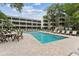 Inviting community pool with lounge chairs and tables in a serene outdoor setting at 415 Ocean Creek Dr. # 2330, Myrtle Beach, SC 29572