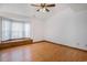 Bright bedroom with hardwood floors, a large window seat, and plenty of space at 4311 Bradford Circle, Myrtle Beach, SC 29588