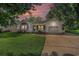 Charming single-story home featuring a well-manicured lawn, attached garage, and welcoming entryway at 4311 Bradford Circle, Myrtle Beach, SC 29588