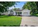Charming single-story home with a well-maintained lawn, driveway, and attached garage at 4311 Bradford Circle, Myrtle Beach, SC 29588