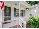 Inviting front porch with decorative door and hanging plants, perfect for relaxing at 4311 Bradford Circle, Myrtle Beach, SC 29588