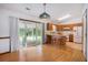 Open-concept kitchen with island, wood cabinets, and bright lighting, adjacent to dining area at 4311 Bradford Circle, Myrtle Beach, SC 29588