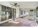 Spacious covered patio with ceiling fan, accessible through sliding glass doors and screened entry at 4311 Bradford Circle, Myrtle Beach, SC 29588