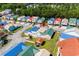 Aerial view of a vibrant community featuring colorful homes and well-maintained streets at 4338 Grande Harbour Blvd., Little River, SC 29566