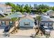 Aerial view of colorful beach houses with well-maintained landscaping and community parking at 4338 Grande Harbour Blvd., Little River, SC 29566