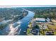 Aerial view of a waterfront community featuring boats and a scenic river at 4338 Grande Harbour Blvd., Little River, SC 29566
