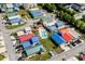 Aerial view of colorful homes surrounding a sparkling community swimming pool at 4338 Grande Harbour Blvd., Little River, SC 29566