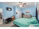 Serene bedroom featuring a desk, closet, and ceiling fan creating a calm and inviting space at 4338 Grande Harbour Blvd., Little River, SC 29566