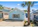 Charming one-story house with light blue siding and a well-manicured front yard at 4338 Grande Harbour Blvd., Little River, SC 29566