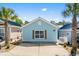 Charming single-story home with light blue siding, brown shutters, and a concrete driveway at 4338 Grande Harbour Blvd., Little River, SC 29566