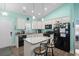 Modern kitchen with white cabinets, granite countertops, stainless steel appliances, and an island at 4338 Grande Harbour Blvd., Little River, SC 29566