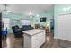 Open living space features a kitchen island, comfortable seating, and natural light, perfect for modern living at 4338 Grande Harbour Blvd., Little River, SC 29566