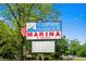 Grande Harbour Marina sign with lush greenery & street view at 4338 Grande Harbour Blvd., Little River, SC 29566