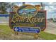 Little River waterfront sign, advertising dining, shops & recreation at 4338 Grande Harbour Blvd., Little River, SC 29566