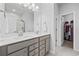 Modern bathroom with double sink vanity, quartz countertops, and a view to bedroom at 4410 Honir Dr., Myrtle Beach, SC 29579