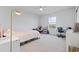 Charming bedroom featuring carpet, a window overlooking the neighborhood, and a cozy bed at 4410 Honir Dr., Myrtle Beach, SC 29579