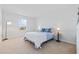 Comfortable bedroom with neutral walls, carpet, a window, and a cozy bed with stylish bedding at 4410 Honir Dr., Myrtle Beach, SC 29579