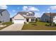 Charming two-story home featuring a two-car garage and well-manicured lawn in a Gathering-friendly community at 4410 Honir Dr., Myrtle Beach, SC 29579