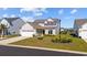 Beautiful single Gathering home featuring a well-maintained lawn, attractive landscaping, and a two-car garage at 4410 Honir Dr., Myrtle Beach, SC 29579