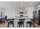 Well-lit kitchen featuring granite countertops, a center island with seating, and stainless steel appliances at 4410 Honir Dr., Myrtle Beach, SC 29579