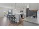 Stylish kitchen with a granite island, stainless steel appliances, pendant lighting, and wood flooring at 4410 Honir Dr., Myrtle Beach, SC 29579