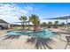 Relaxing lazy river with lounge chairs and palm trees, perfect for a resort-style living at 4410 Honir Dr., Myrtle Beach, SC 29579