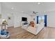 Bright living room with backyard views, a white sofa, and a decorative fireplace at 4410 Honir Dr., Myrtle Beach, SC 29579