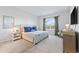 Bright and airy main bedroom featuring a large bed and a window with backyard views at 4410 Honir Dr., Myrtle Beach, SC 29579