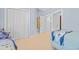 Spacious light blue bedroom with double closets and carpet, offering ample room for storage and comfort at 444 Dornoch Dr., Pawleys Island, SC 29585